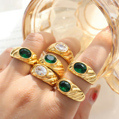 Gold ring with white and green diamonds